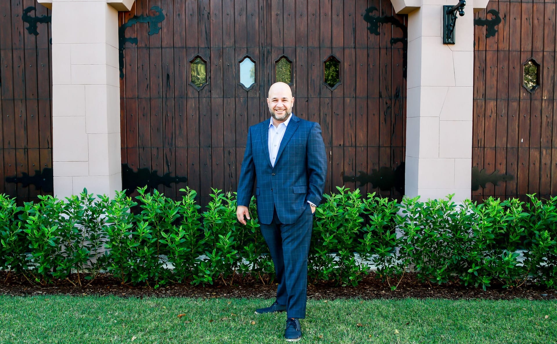 Tyson Kutner, Esq., personal injury attorney, standing outside his South Florida office